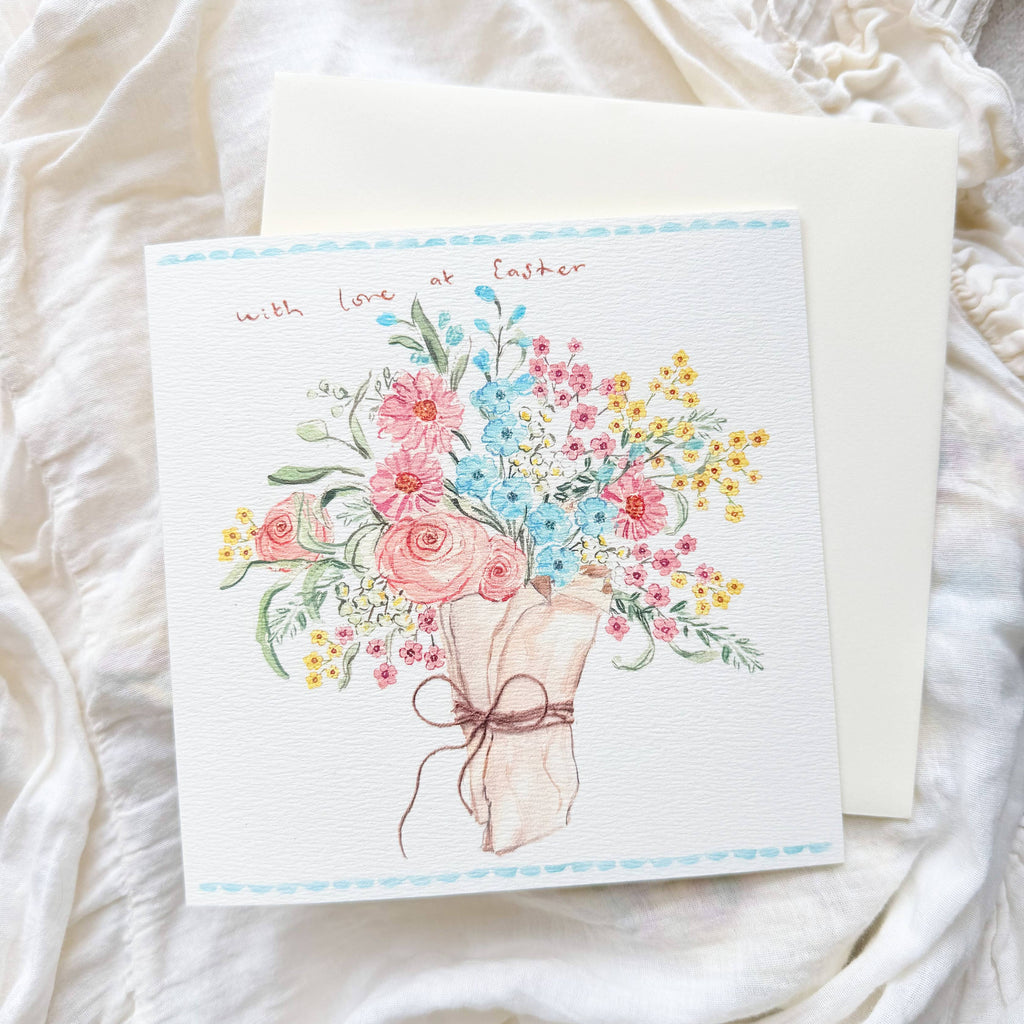 Greeting card with floral design on a white textured surface