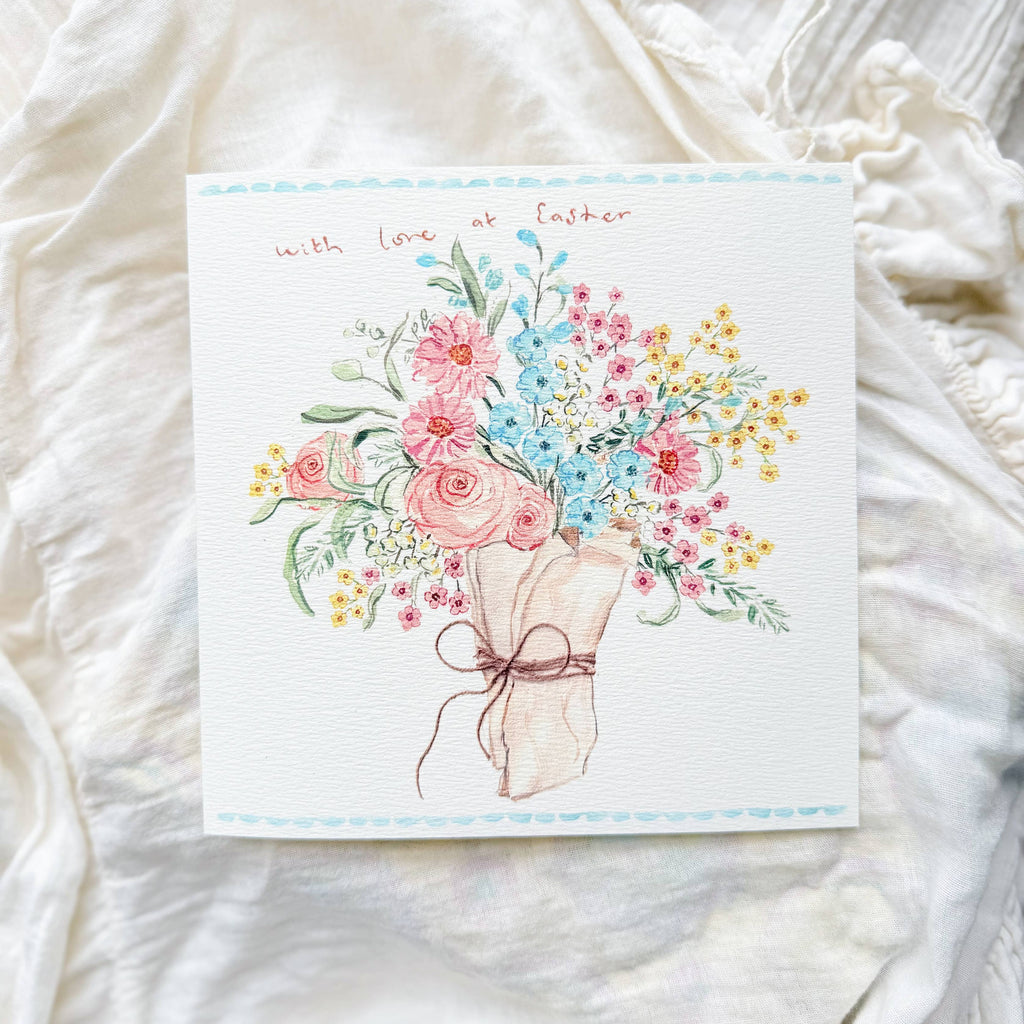 Greeting card with floral design and text on a white fabric background