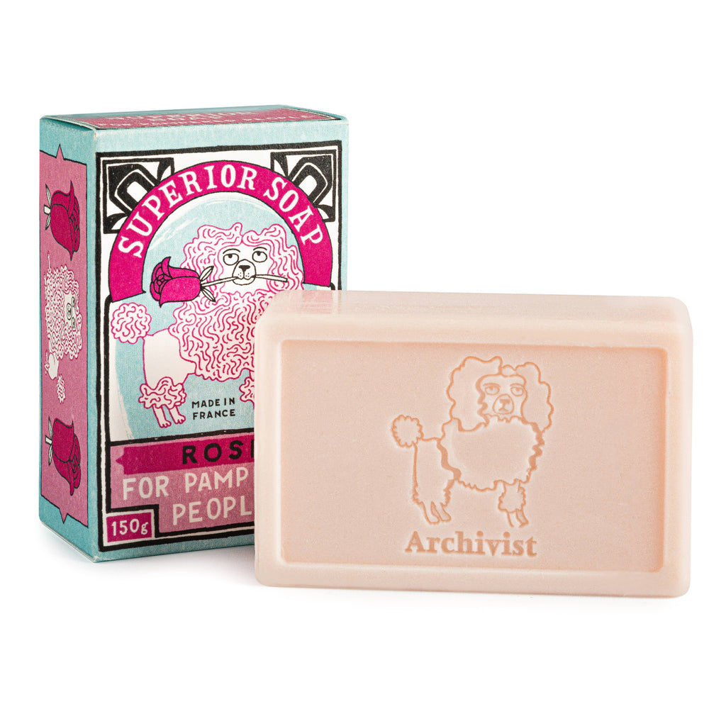 Bar of soap with 'Archivist' branding next to its packaging on a white background