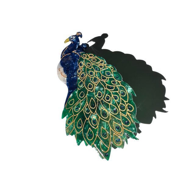 Peacock with vibrant green and gold feathers on a white background