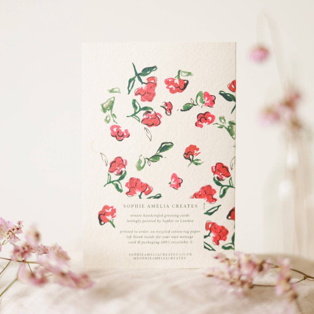 Floral design on a card with a blurred floral background