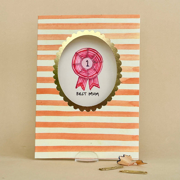 Card with striped design and pink ribbon badge on a beige background