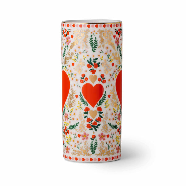 Decorative cylindrical container with heart and floral pattern on a white background