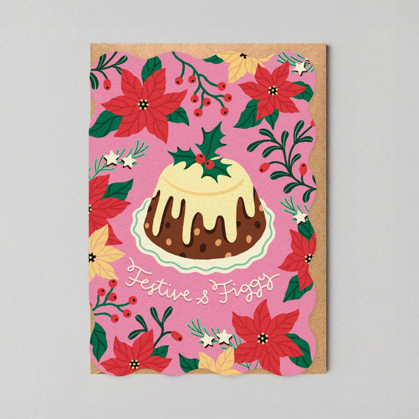 Greeting card with a Christmas-themed design featuring a cake and poinsettias on a pink background.
