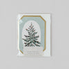 Greeting card with Christmas tree design on a light gray background