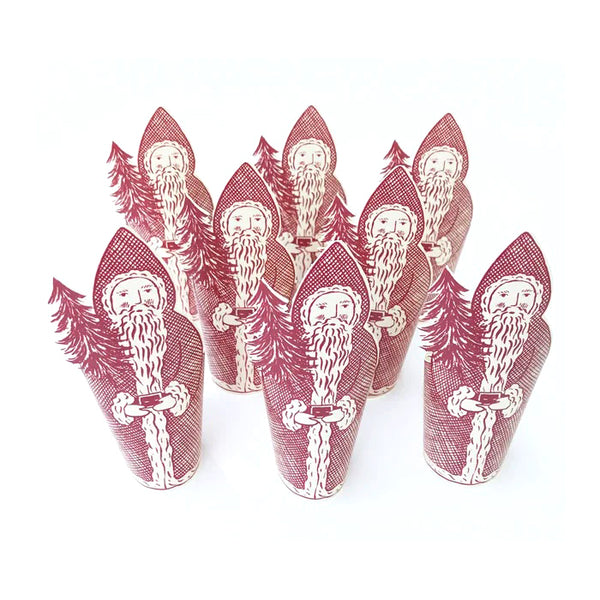 Set of red and white Santa Claus-themed paper cups on a white background