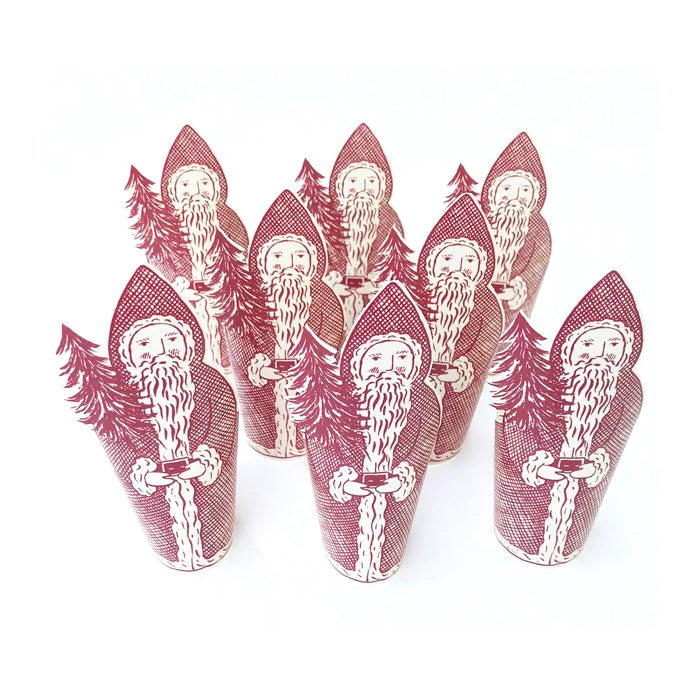 Set of red and white Santa Claus-themed paper cups on a white background