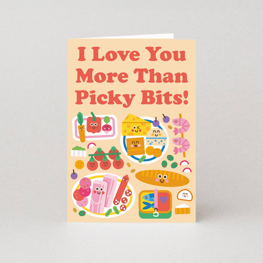 Card with colorful illustrations of food items and text 'I Love You More Than Picky Bits!' on a light gray background