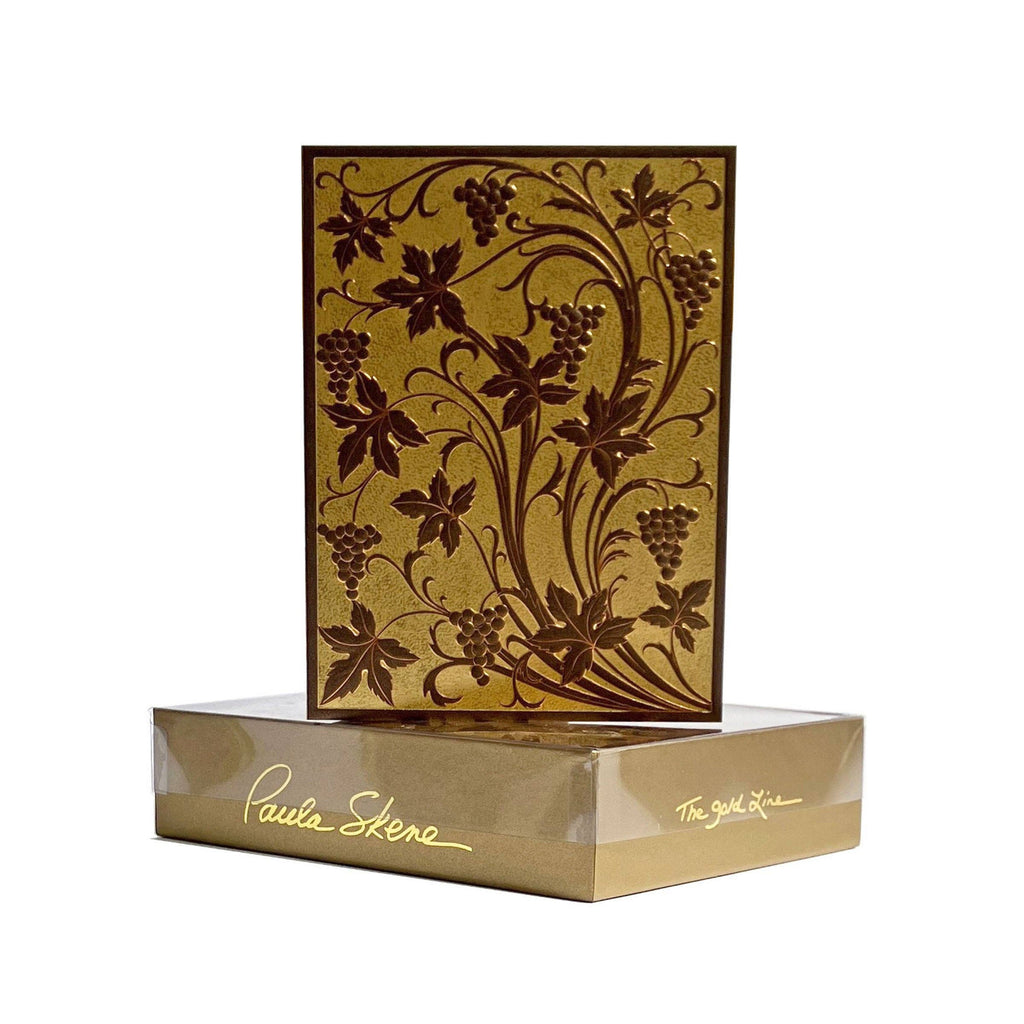 Decorative box with floral design and 'Paula Skene' branding on a white background