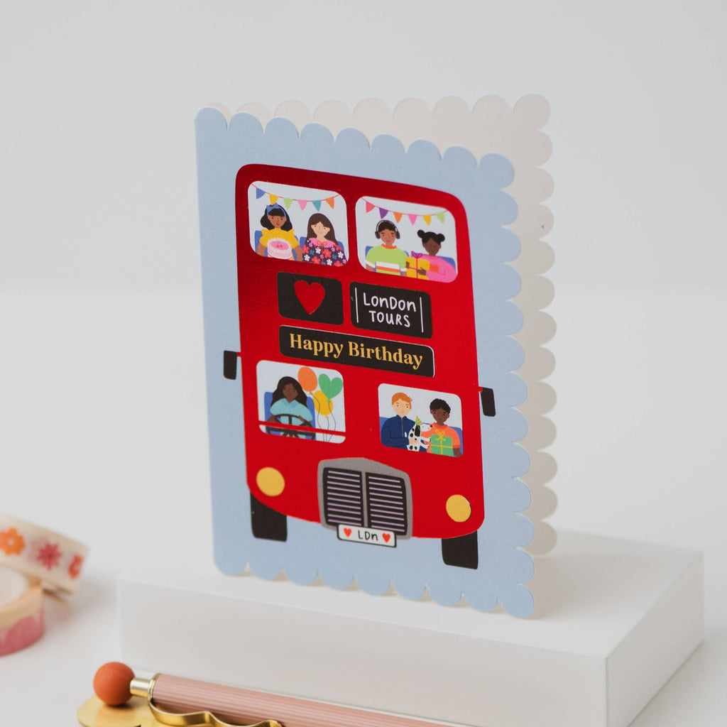 Card with a red London bus design on a white background