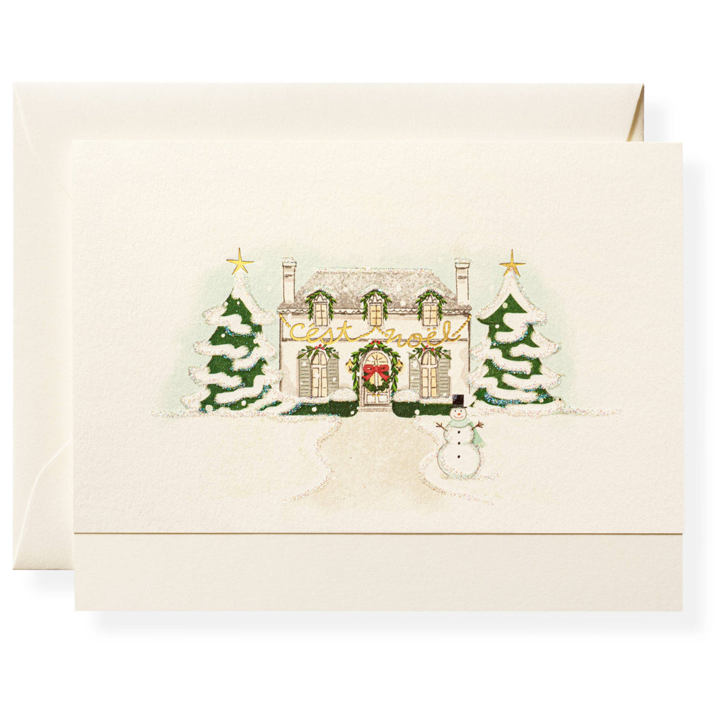 Christmas-themed card with a house, trees, and snowman on a white background