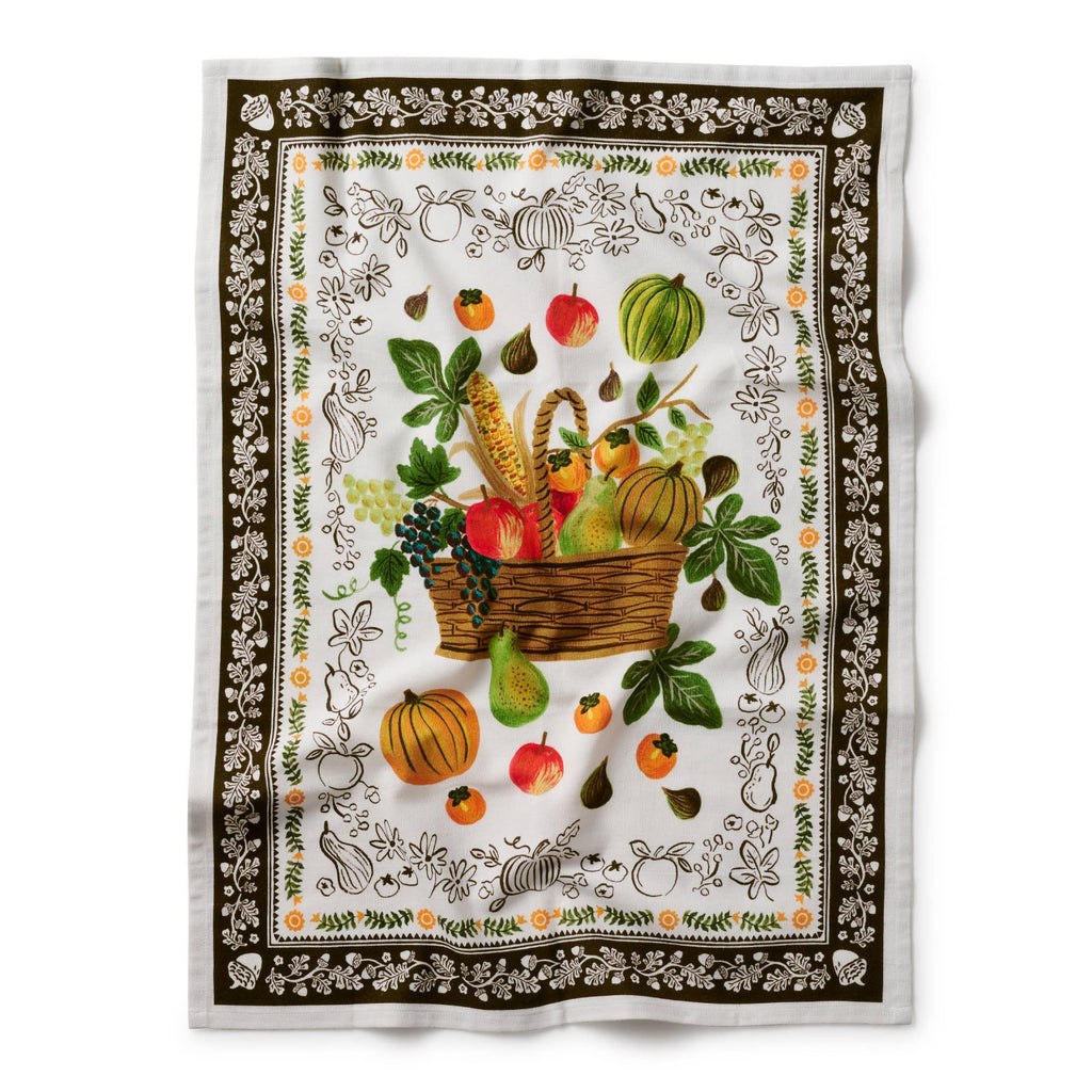 Decorative towel with fruit and vegetable design on a white background