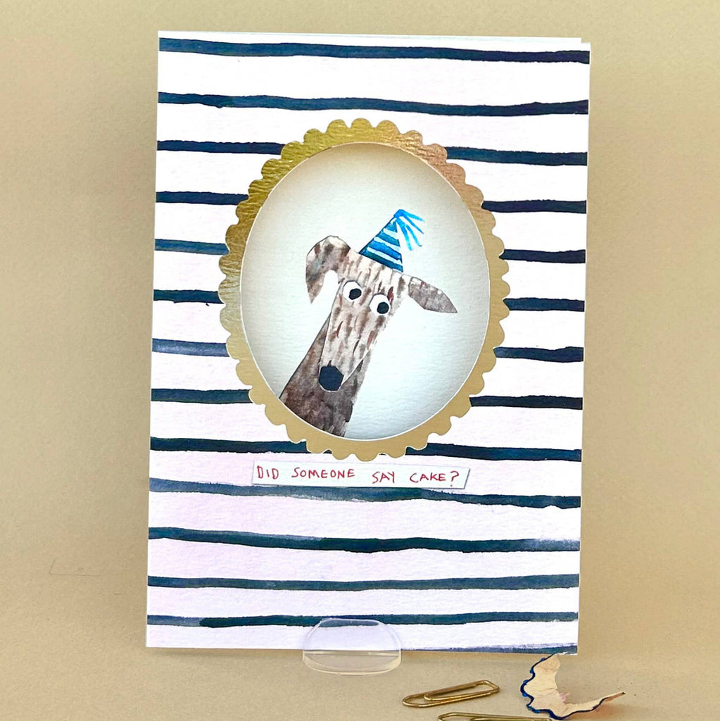 Greeting card with a giraffe illustration and striped design on a beige background