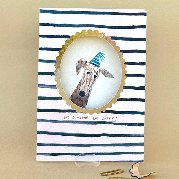 Greeting card with a giraffe illustration and striped design on a beige background