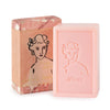 Pink soap bar and packaging with a woman's face design on a white background