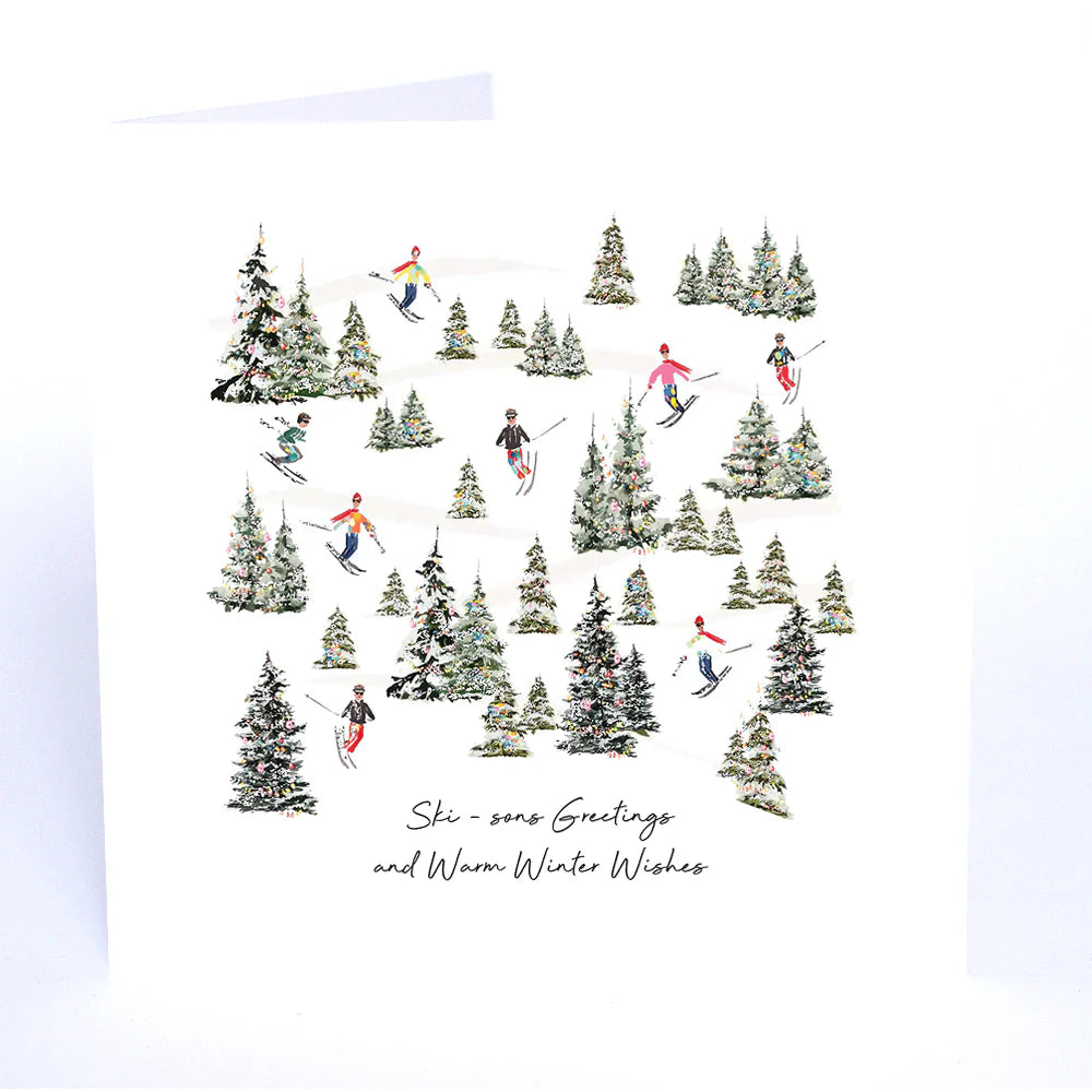 Greeting card with skiers and trees design on a white background