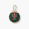 Decorative angel ornament with floral design on a white background