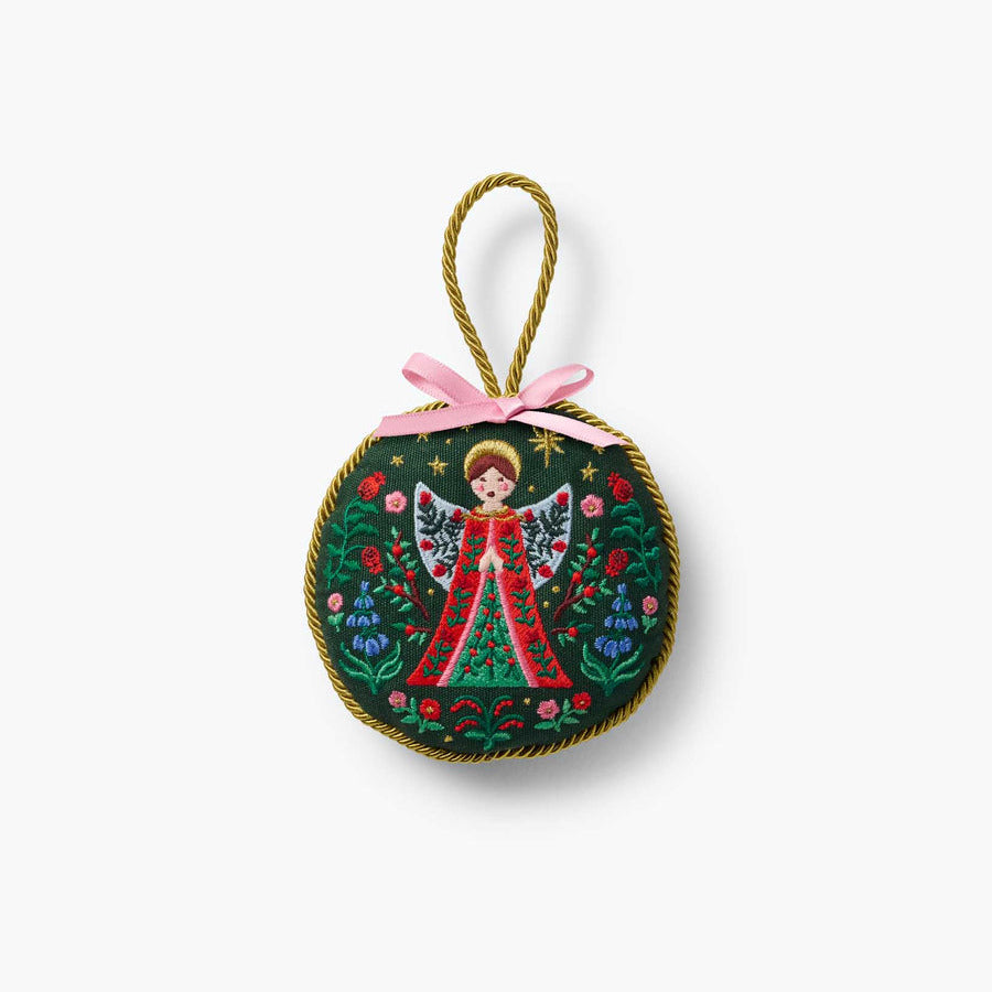 Decorative angel ornament with floral design on a white background