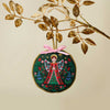 Decorative angel ornament with pink ribbon on a beige background