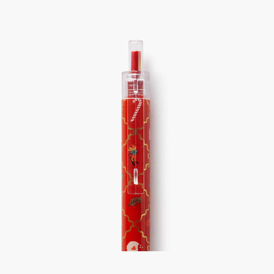 Red pen with gold accents on a white background