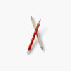 Two pens with decorative designs on a white background