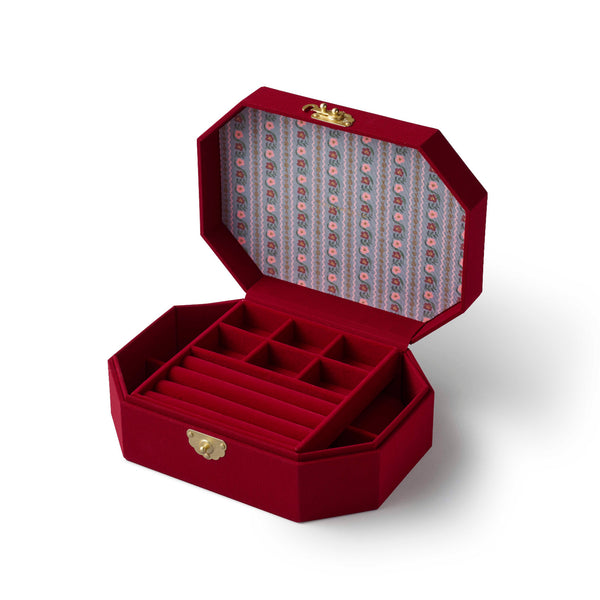 Red jewelry box with a patterned interior on a white background
