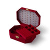 Red jewelry box with gold accents on a white background