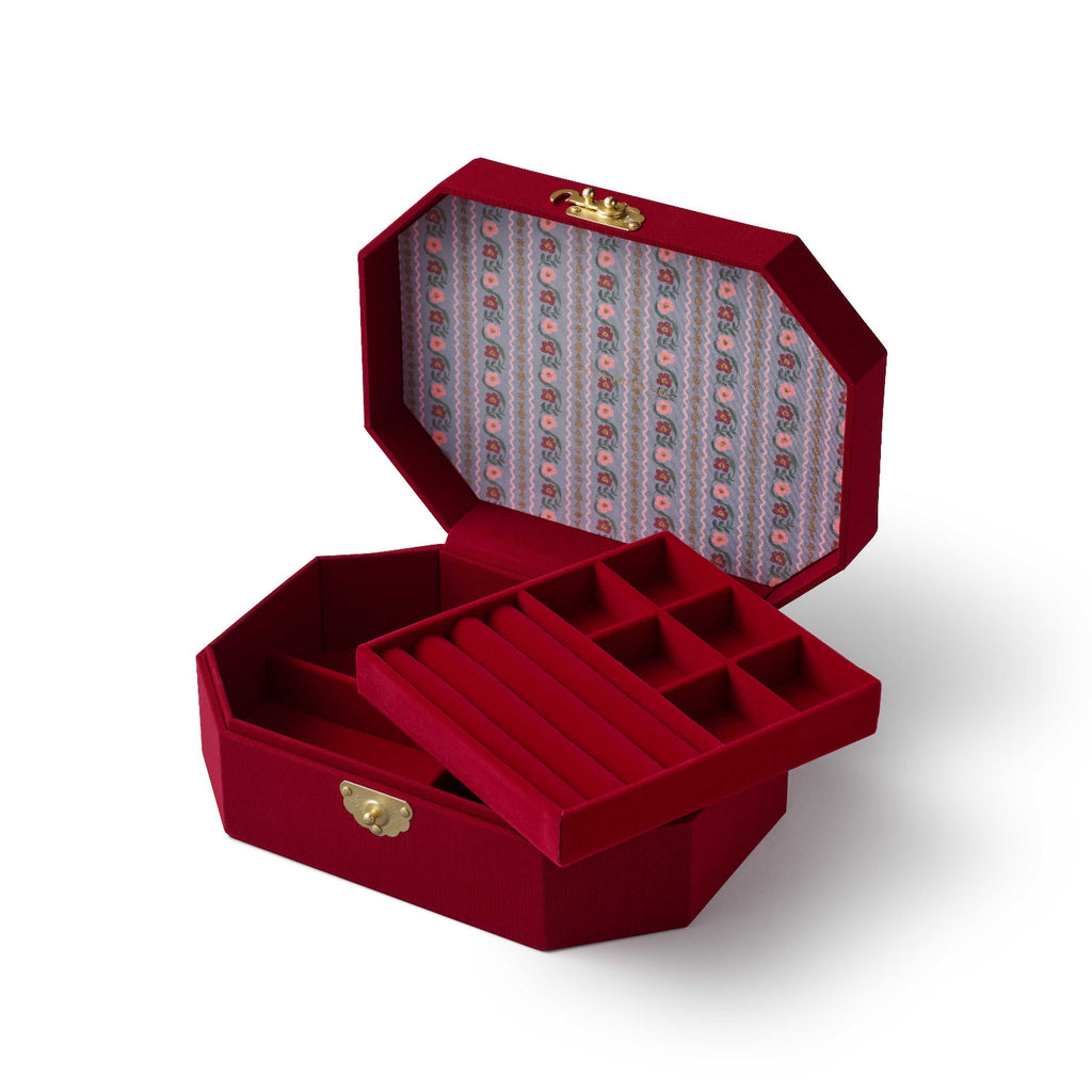 Red jewelry box with gold accents on a white background