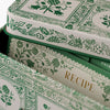 Stack of recipe cards with green floral patterns on a white background