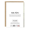 Back of a Dania Odada Bi & Shoaf Collection card or art print, showing printed text on a white card with a kraft envelope behind it, photographed against a light gray background.