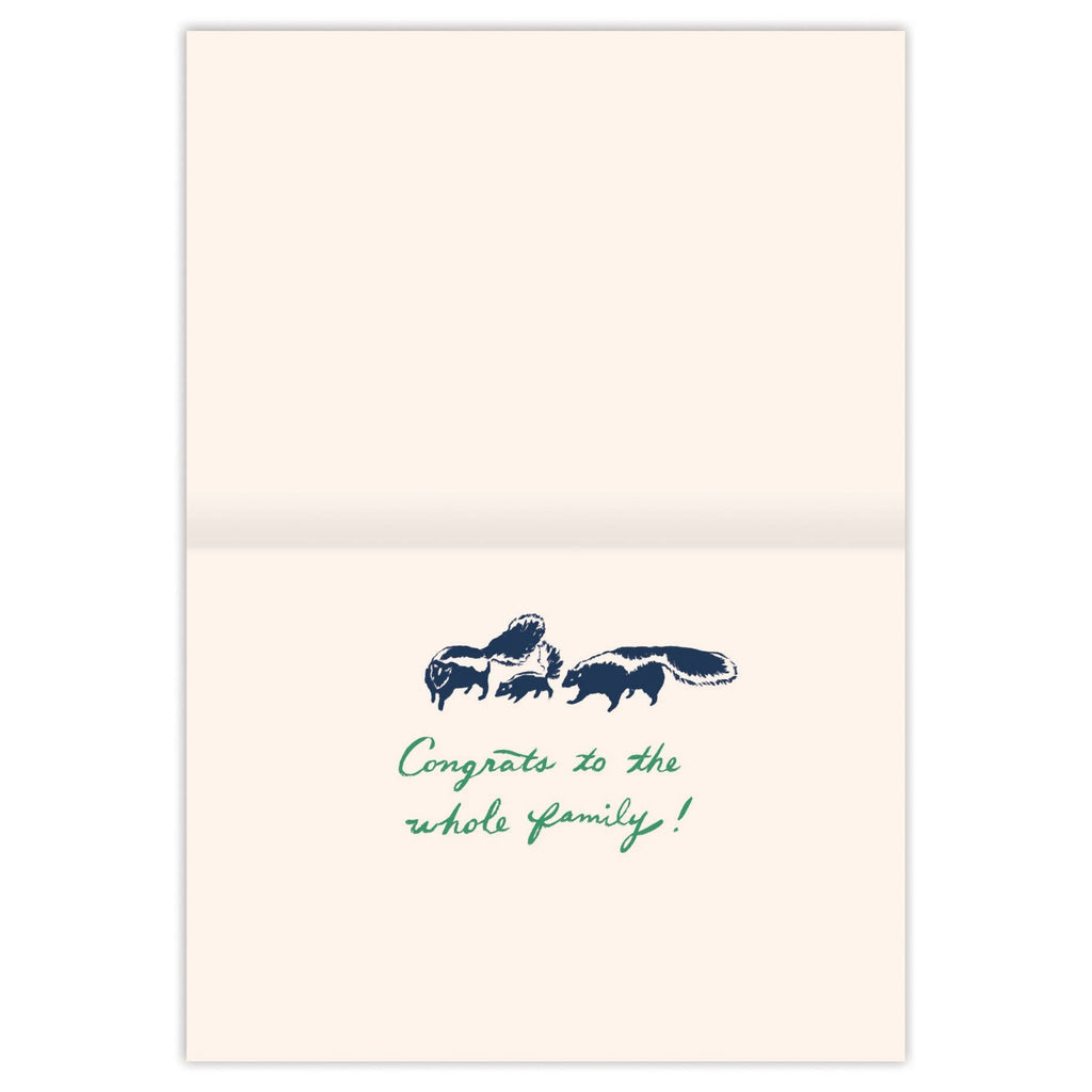 Greeting card with a family of skunks illustration and 'Congrats to the whole family!' text on a white background.