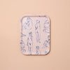 Rectangular tray with blue line drawings of nude figures on a beige background
