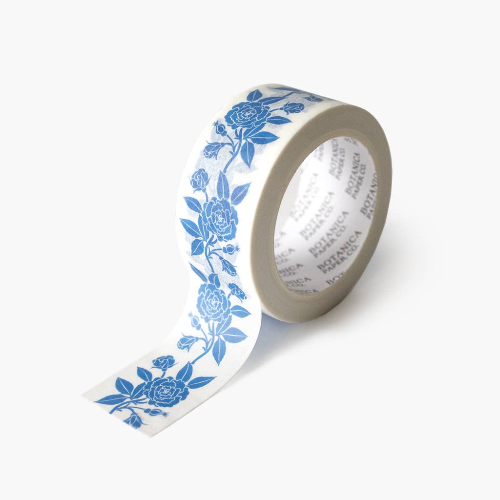 Roll of decorative tape with blue floral pattern on a white background