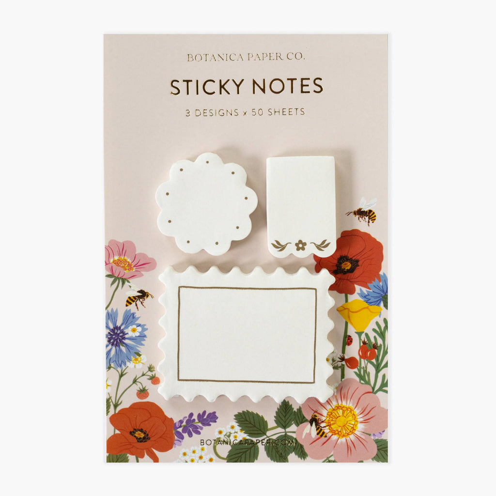 Floral sticky notes with decorative designs on a beige background