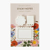 Floral sticky notes with decorative designs on a beige background