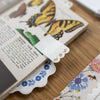 Floral bookmark on a book with butterfly illustrations