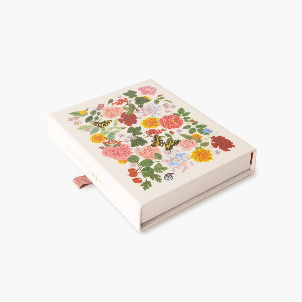 Floral and butterfly design notebook on a white background