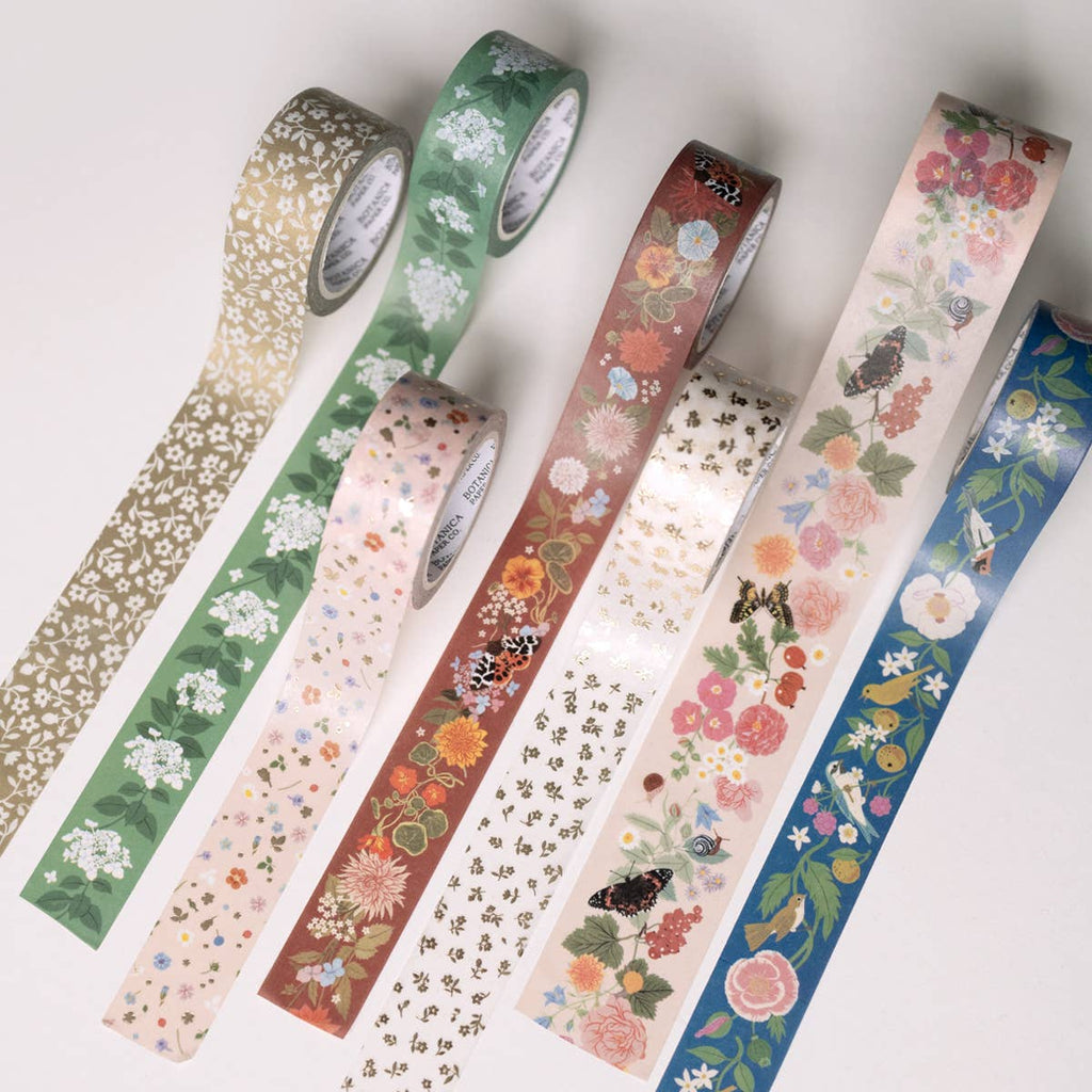 Set of decorative tape rolls with floral and nature-themed designs on a white background