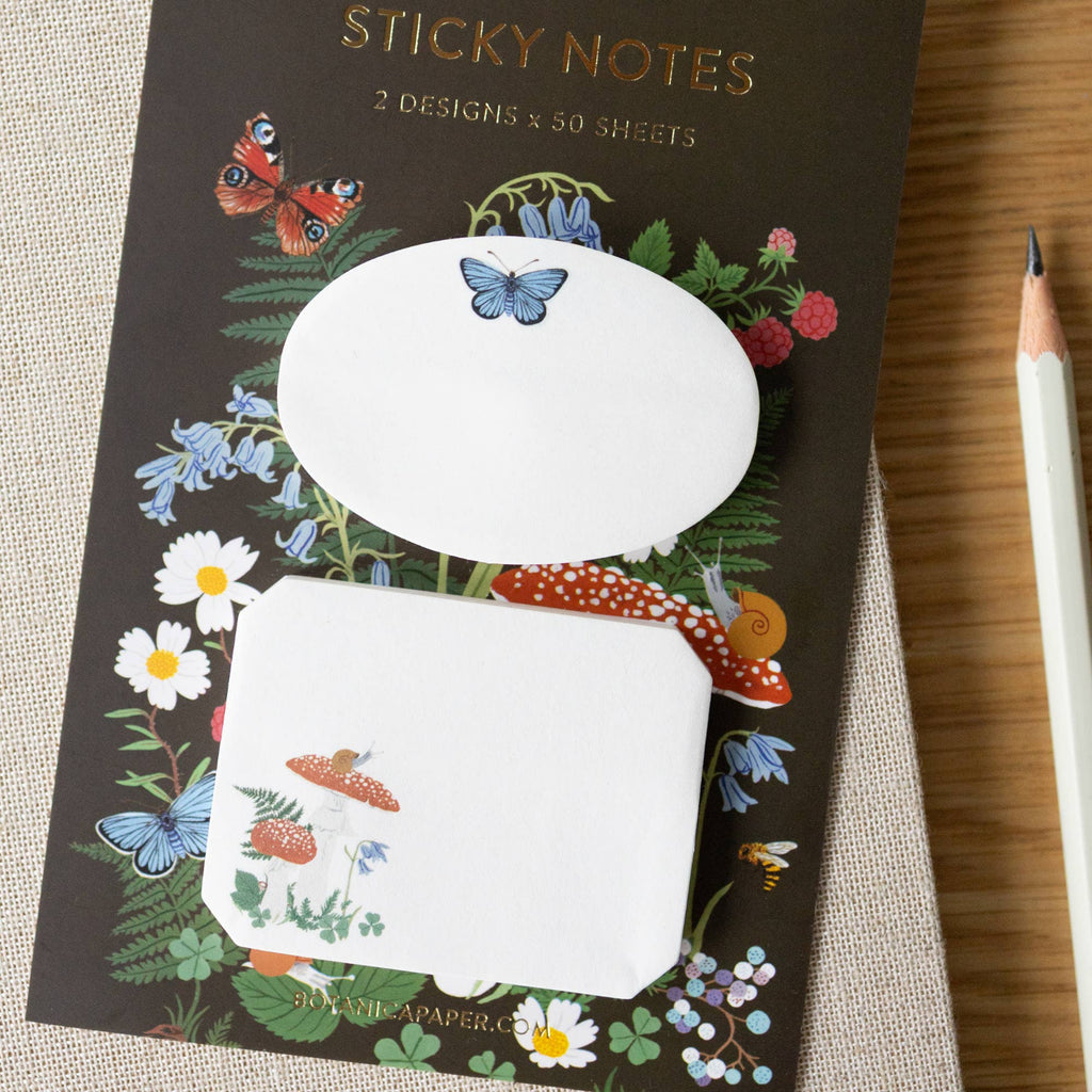 Sticky notes with nature-themed design on packaging, featuring butterflies and flowers.