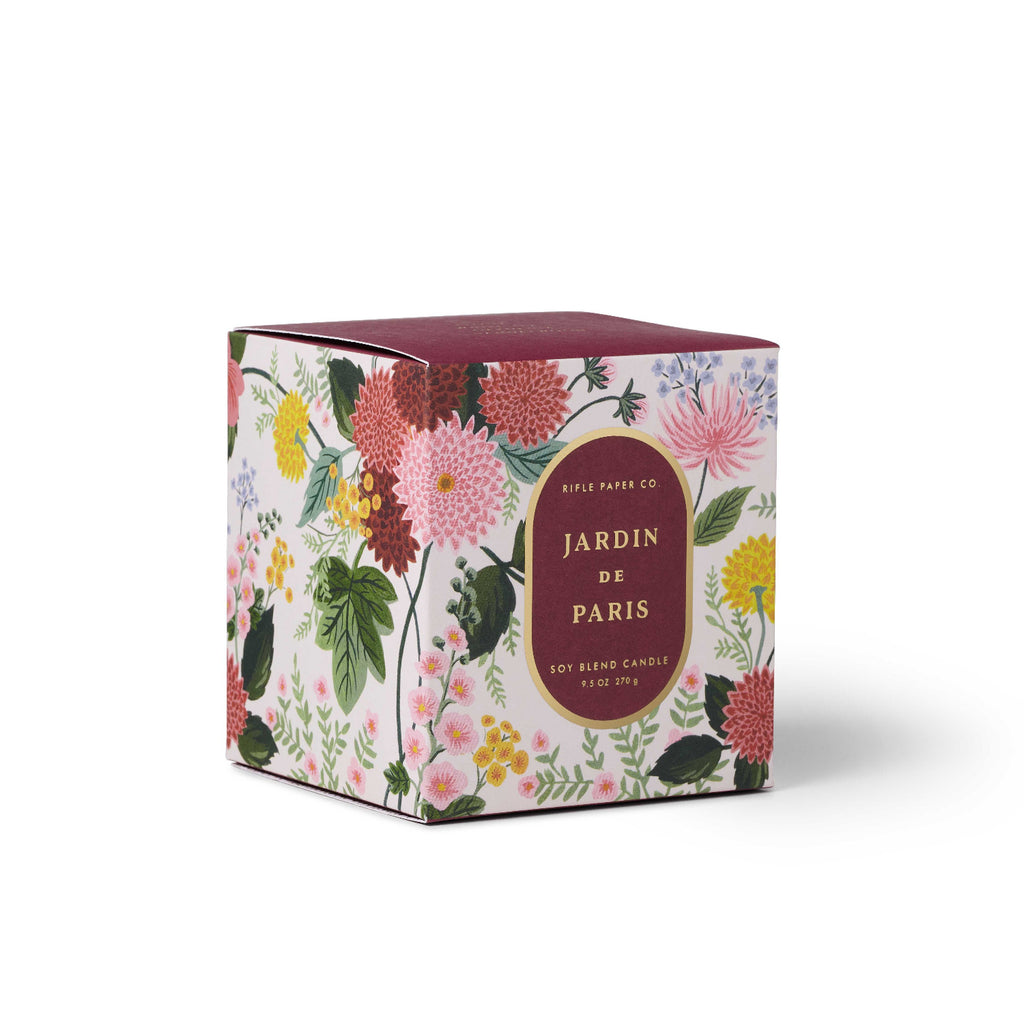 Floral packaging of a candle with 'Jardin de Paris' text on a white background