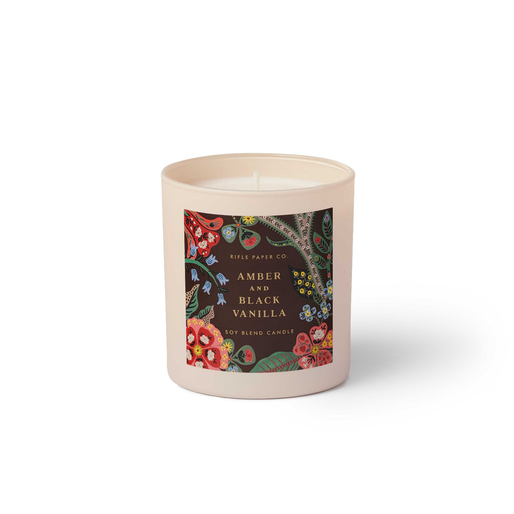 Candle with a decorative label on a white background