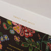 Floral packaging with 'Sweet and Spicy' text on a white background