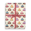 Gift wrap with cake pattern and red ribbon on a white background