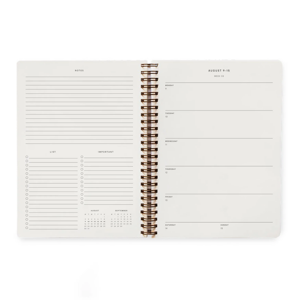 An open spiral-bound planner or agenda showing two white interior pages with lined notes, checkboxes, and weekly planning sections, photographed on a clean white background.