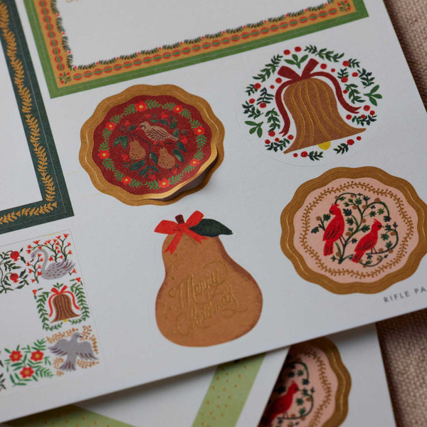 Set of decorative stickers with festive designs on a white background