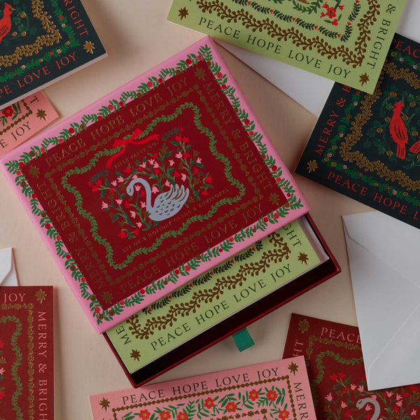 Collection of Christmas-themed greeting cards with decorative designs on a light background.