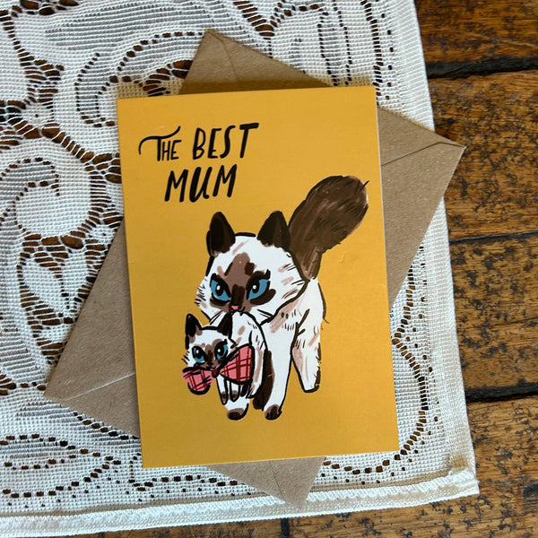 Greeting card with dog illustration and 'The Best Mum' text on a lace doily.