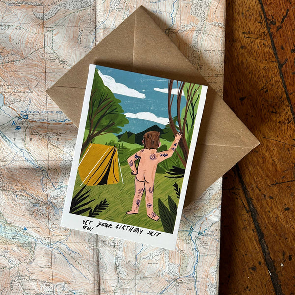 Illustrated card with a person by a tent on a map background