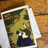 Father's Day card with illustration of a boy and bird on a wooden surface