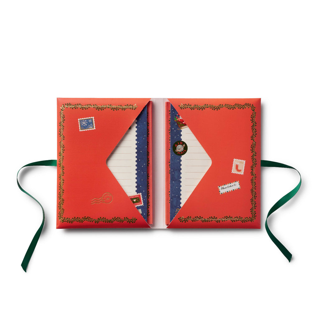 Open red book with decorative elements on a white background